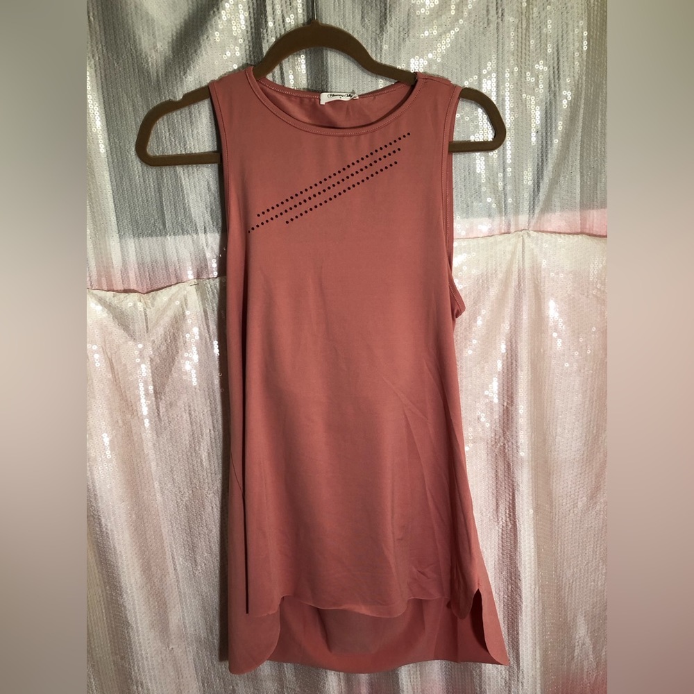 Shirt by Blooming Jelly size small abs the color is light pink.